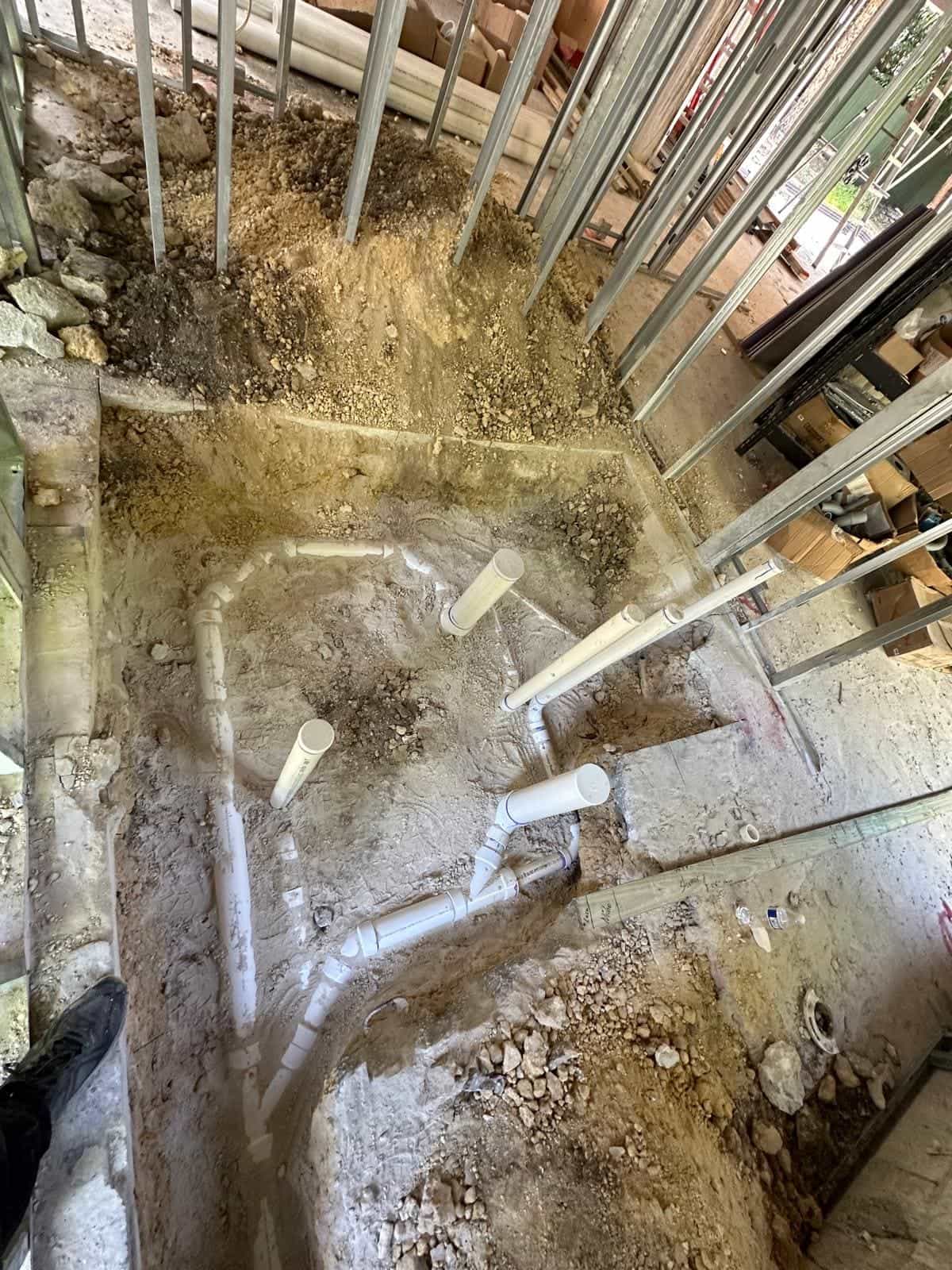 Before and after of a Underground pipe assemply by a plumber in Medley